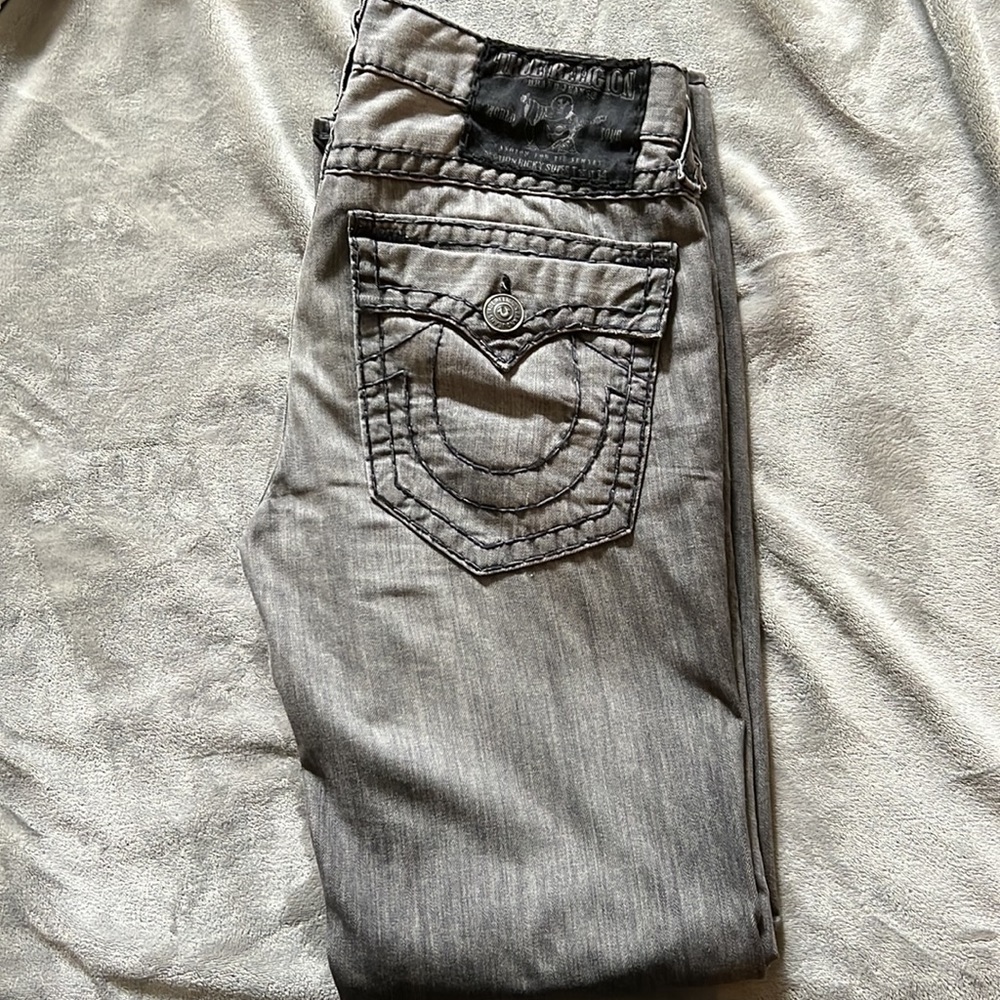 Grey with black lining True Religion jeans.